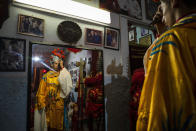 A dancer from the Cuban Wushu Association prepares for his performance before the ceremony to welcome the Chinese New Year in Havana, Cuba, Friday, Jan. 24, 2020. Cuba's small Chinese community celebrated the Lunar New Year Friday night, ushering in the "Year of the Rat" with a colorful parade, brightly lit lanterns and a dragon wending its way through the narrow streets of Chinatown. (AP Photo/Ramon Espinosa)