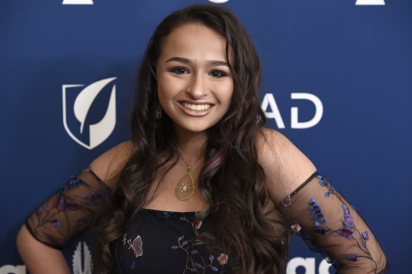 Jazz Jennings posing in a patterned dress