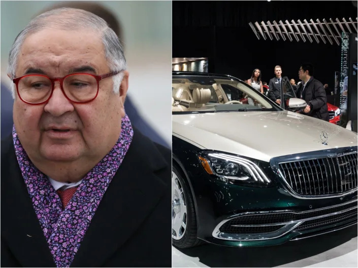 Russian billionaire and businessman Alisher Usmanov next to a picture of a Maybach S650 model by Mercedes-Benz at the New York International Auto Show