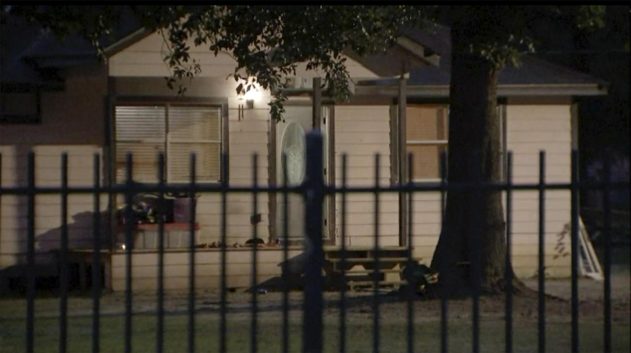 This image provided by KTRK shows the scene of a shooting early Saturday, April 29, 2023 in Cleveland, Texas. A man went next door with a rifle and began shooting his neighbors, killing several including an 8-year-old inside the house, after the family asked him to stop firing rounds in his yard because they were trying to sleep, authorities said Saturday. (KTRK via AP)