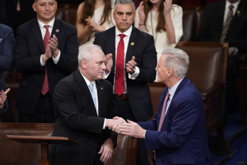 Rep. Steve Scalise, R-La., shakes hands with Rep. Kevin McCarthy, R-Calif., after nominating him for the third round of votes for Speaker of the House on the opening day of the 118th Congress at the U.S. Capitol, Tuesday, Jan. 3, 2023, in Washington.(AP Photo/Alex Brandon)