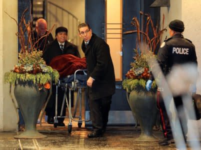 One of two bodies is removed from the home of billionaire founder of Canadian pharmaceutical firm Apotex Inc., Barry Sherman and his wife Honey, who were found dead under circumstances that police described as