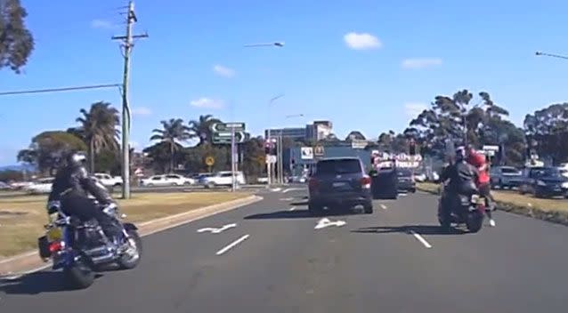 The driver of the 4WD emerges suddenly and throws at least one punch at the cyclist on the right. Photo: Dash Cam Owners Australia