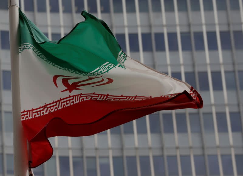 An Iranian flag flutters in front of the IAEA headquarters in Vienna