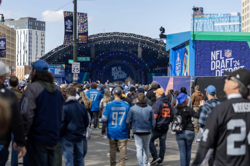 Fans make their way toward the 2024 NFL Draft on Thursday near Campus Martius Park in Detroit. Photo by Rena Laverty/UPI