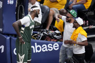 Milwaukee Bucks forward Bobby Portis (9) talks with fans during the second half against the Indiana Pacers in Game 6 in an NBA basketball first-round playoff series, Thursday, May 2, 2024, in Indianapolis. (AP Photo/Michael Conroy)