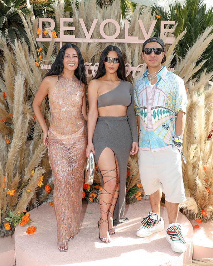 Kim Kardashian (center) with Revolve CEO and founder Michael Mente at Revolve Festival on April 16, 2022 in La Quinta, Calif., during Coachella. - Credit: Sansho Scott/BFA.com