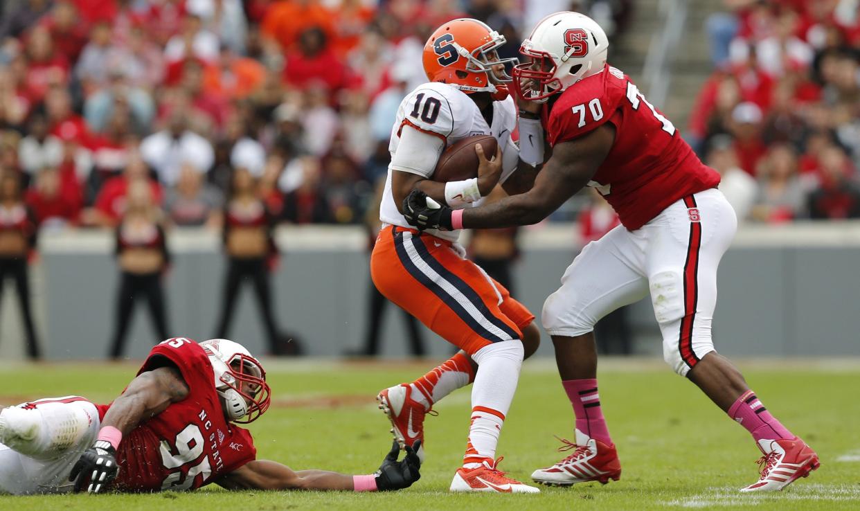 Former North Carolina State defensive tackle Carlos Gray (R) was found dead in his home on Monday. (Ethan Hyman/Raleigh News & Observer/MCT)