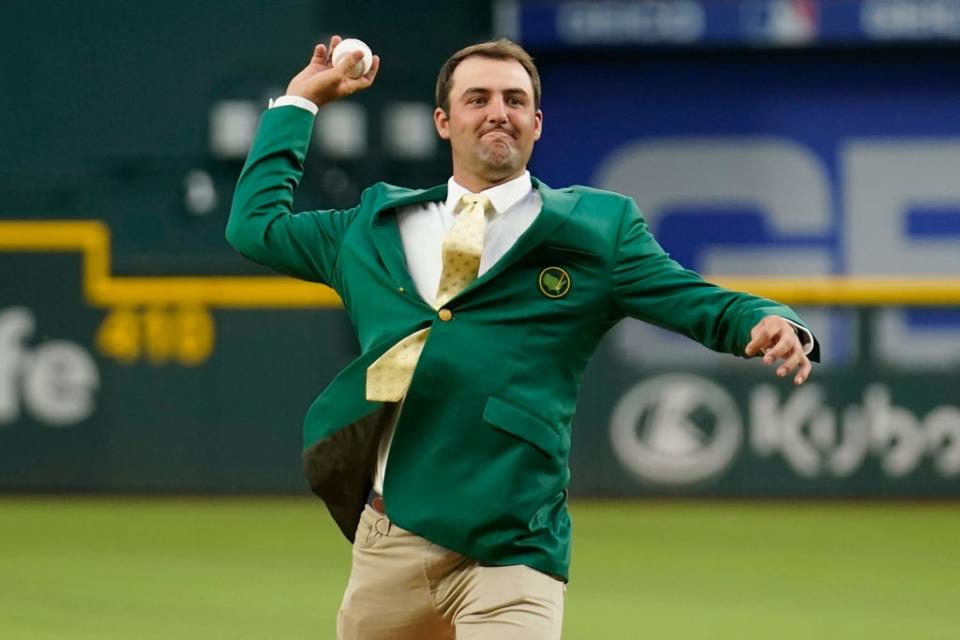 Masters champion Scottie Scheffler throws a ceremonial first pitch before the game between the Houston Astros and the Texas Rangers (Tony Gutierrez/AP) (AP)