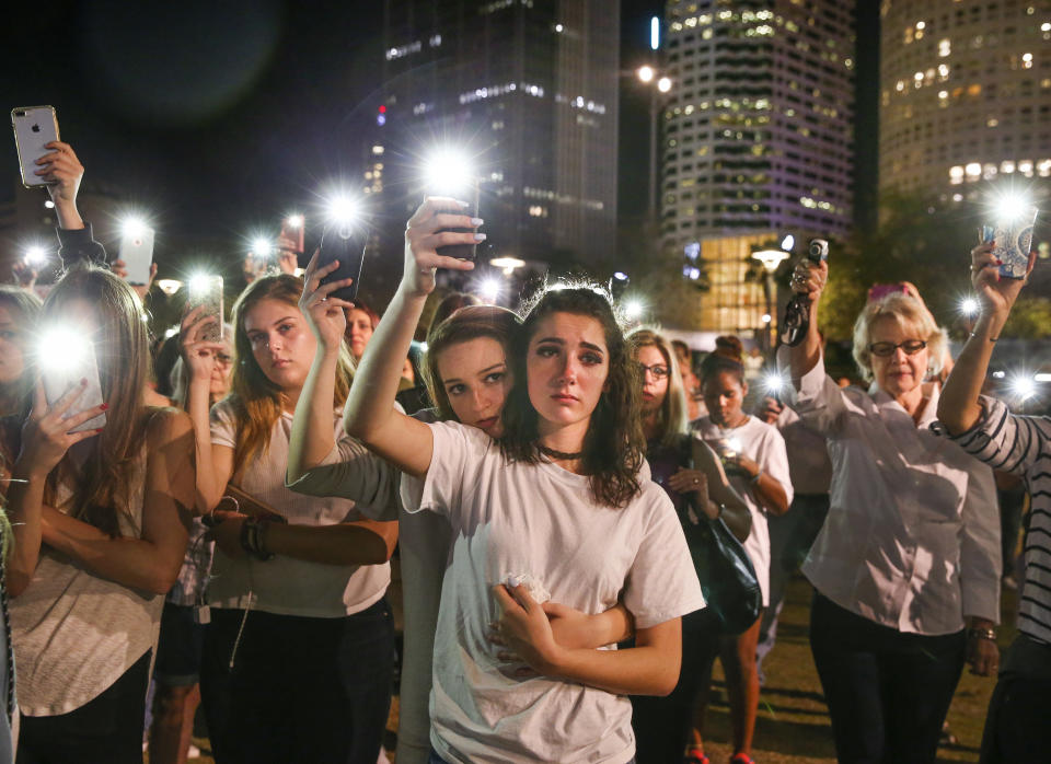 Students attend a vigil in Tampa, Fla., to honor victims of last week’s mass shooting at Marjory Stoneman Douglas High School in Parkland, Fla. Photo: Dirk Shadd/Tampa Bay Times via AP