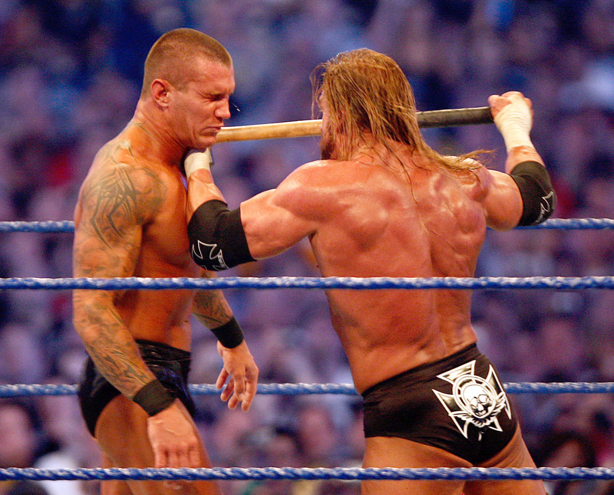 HOUSTON - APRIL 05: Triple H hits Randy Orton with a sledgehammer during their WWE Championship match at 