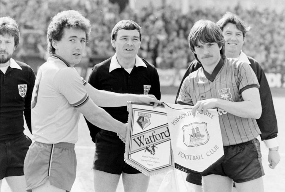 Watford Observer: Captain Wilf Rostron exchanges pennants in the traditional pre-match photo