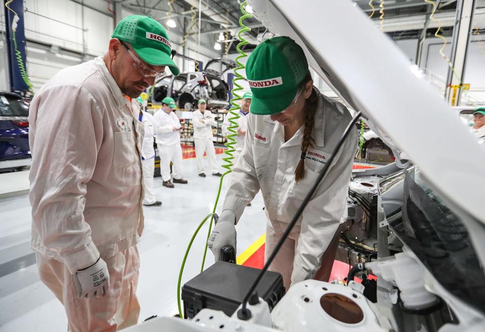 Hoosiers can expect to see a nearly 30% in the green job market within the next five years, according to a July 2022 study conducted by the nonprofit WorkingNation. From left, trainer Joe Baumann shows trainer Elizabeth Harriman how to install the mission mount on a CR-V Hybrid at Honda Manufacturing of Indiana on Wednesday, March 5, 2020, in Greensburg, Ind.