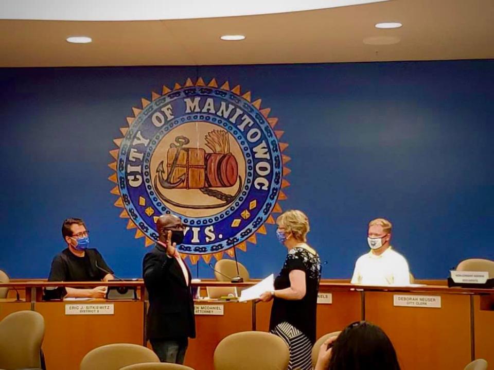 Aaron Bailey is sworn in as alderperson for District 7 on the Manitowoc Common Council Monday. Bailey is the first Black man to serve on the council.