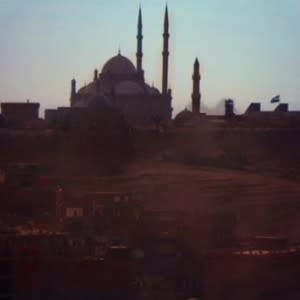 A View From The Top: In Moqattam, the bulky biodigesters are often installed on the rooftops of homes. The roof overlooks Cairo's historic Citadel and pyramids, offering a glimpse of its past and present. 