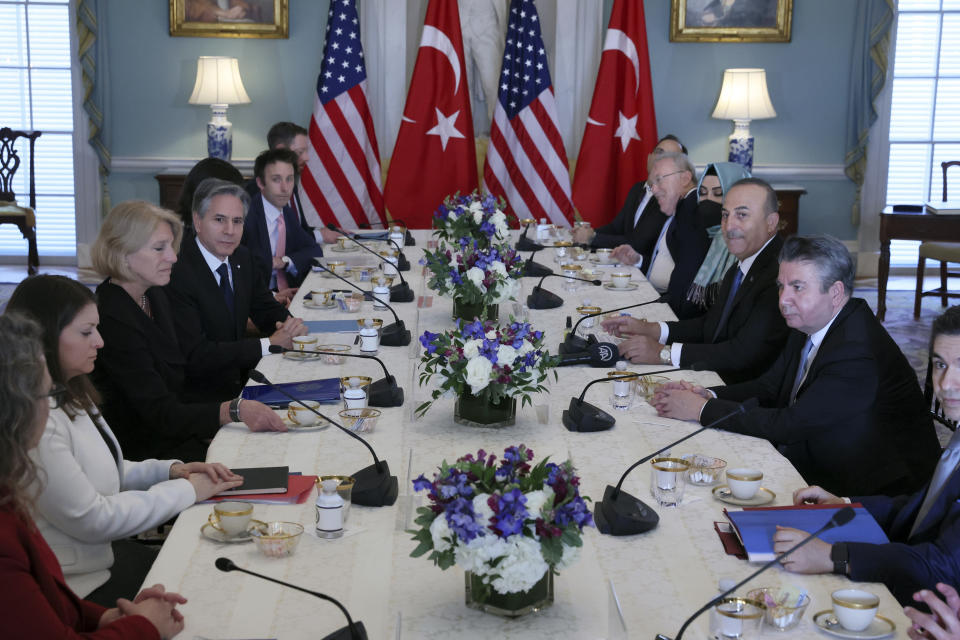 U.S. Secretary of State Antony Blinken and Turkey's Foreign Minister Mevlut Cavusoglu meet at the State Department in Washington, Wednesday, Jan. 18, 2023. (Leah Millis/Pool via AP)