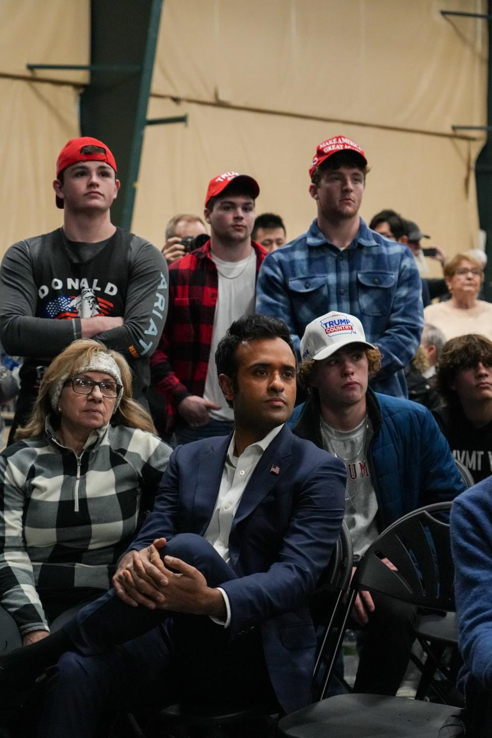 GOP presidential candidate Vivek Ramaswamy listens to former President Donald Trump speak on Monday, Jan. 15, 2024, at Horizon Events Center in Clive.