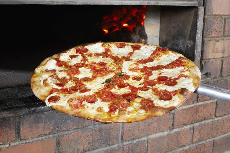 Grimaldi’s is famous for its coal-fired pizzas, which have a crunchy texture and smoky flavor.