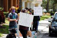 Protesters gather outside the Florida home of former Minneapolis police officer Derek Chauvin, in Orlando