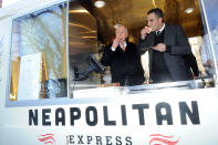 Legendary energy executive T. Boone Pickens, left, and Max Crespo, Founder of Neapolitan Express, enjoy pizza as they launch Neapolitan Express, the first mobile food truck fully-powered by compressed natural gas, Thursday, Feb. 21, 2013, at City Hall Park in New York. (Diane Bondareff/Invision for Neapolitan Express/AP Images)