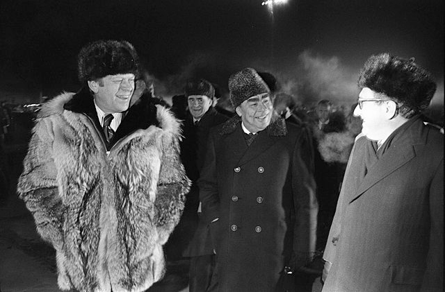 Photograph of President Gerald Ford, Secretary Leonid Brezhnev, and Henry Kissinger at the Conclusion of the Vladivostok Summit 