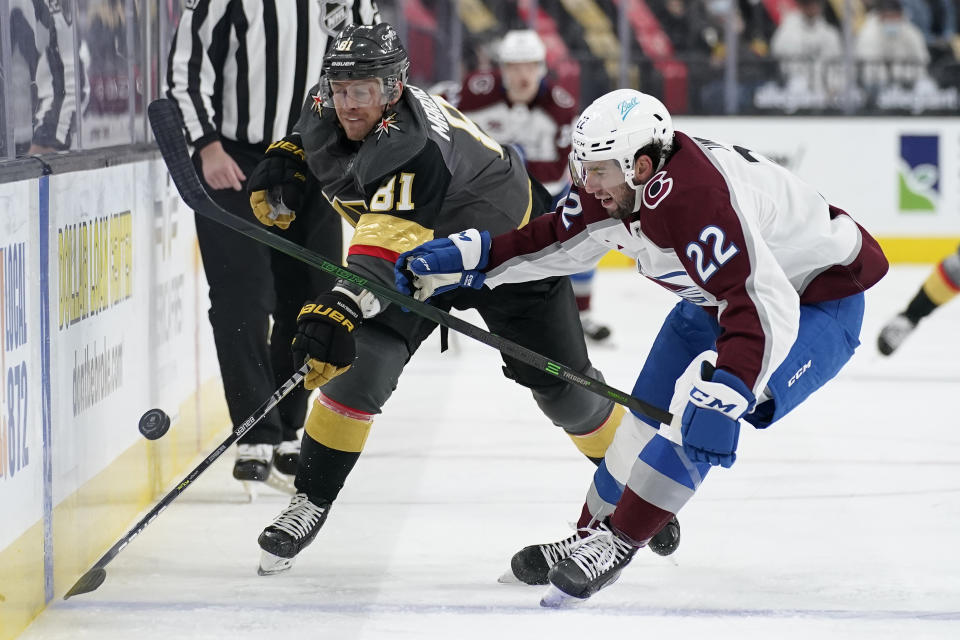 Vegas Golden Knights center Jonathan Marchessault (81) vies for the puck with with Colorado Avalanche defenseman Conor Timmins (22) during the second period of an NHL hockey game Monday, May 10, 2021, in Las Vegas. (AP Photo/John Locher)
