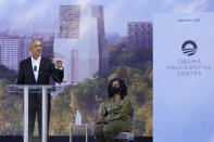 Former President Barack Obama speaks as former first lady Michelle Obama listens during a groundbreaking ceremony for the Obama Presidential Center Tuesday, Sept. 28, 2021, in Chicago. (AP Photo/Charles Rex Arbogast)