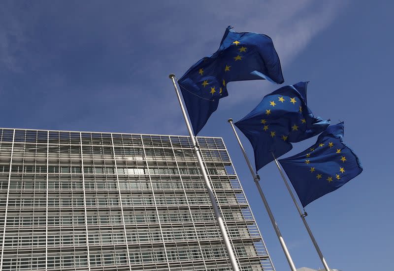 FILE PHOTO: European Union flags flutter outside the European Commission headquarters in Brussels