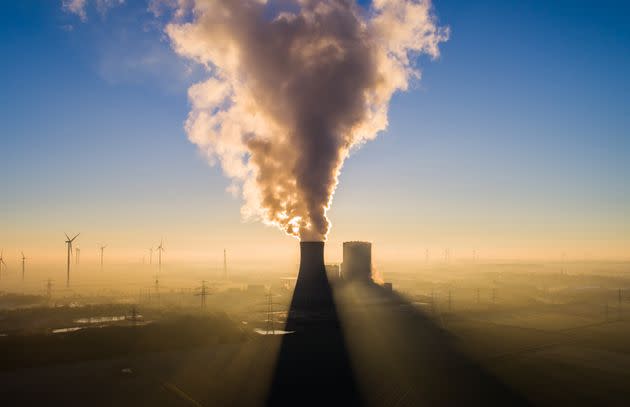 The sun rises behind Mehrum power plant in Hohenhamein, Germany, on Feb. 7. The coal-fired plant has been back on the grid as a 