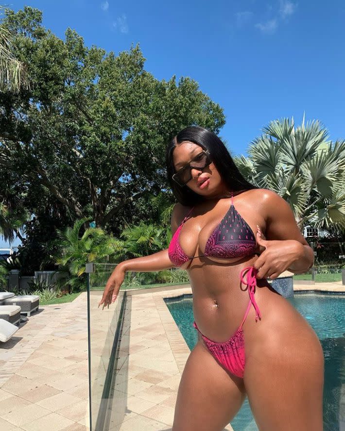 "Savage" rapper Megan Thee Stallion is all curves in stunning poolside photo wearing a hot pink bikini on Monday, Aug. 10, 2020. "Y’all want me to put this bikini up on my website today"