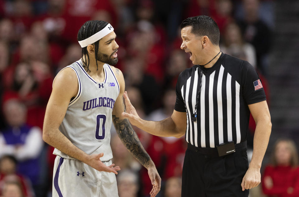 Northwestern's Boo Buie (0) complains to a referee about a foul called on his teammate while playing against Nebraska during the second half of an NCAA college basketball game Saturday, Jan. 20, 2024, in Lincoln, Neb. Nebraska defeated Northwestern 75-69. (AP Photo/Rebecca S. Gratz)