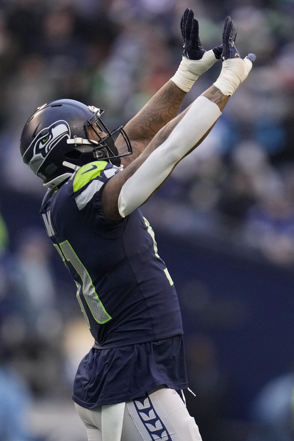Seattle Seahawks linebacker Bruce Irvin (51) celebrates during the first half of an NFL football game against the Carolina Panthers, Sunday, Dec. 11, 2022, in Seattle. (AP Photo/Gregory Bull)