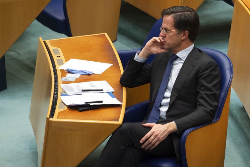 In this file photo, caretaker Dutch Prime Minister Mark Rutte listens to the debate in parliament