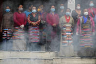 Friends and family members gather for the funeral of veteran Nepalese Sherpa guide Ang Rita, in Kathmandu, Nepal, Wednesday, Sept. 23, 2020. Ang Rita, who was the first person to climb Mount Everest 10 times has died Monday at age 72 after a long illness. (AP Photo/Niranjan Shrestha)