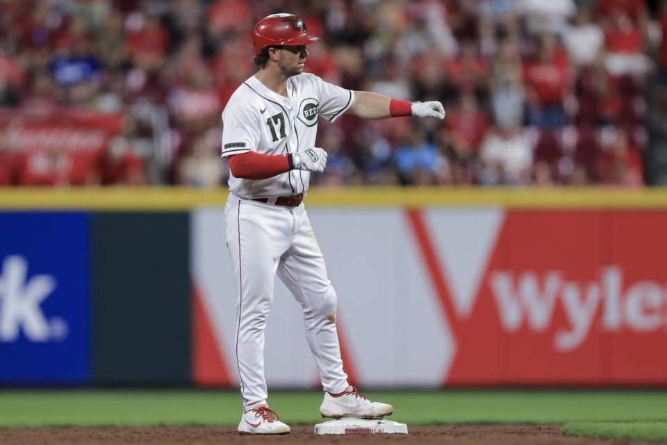 The Reds' Kyle Farmer gestures to teammates after hitting a fifth-inning double Sept. 17, 2021.