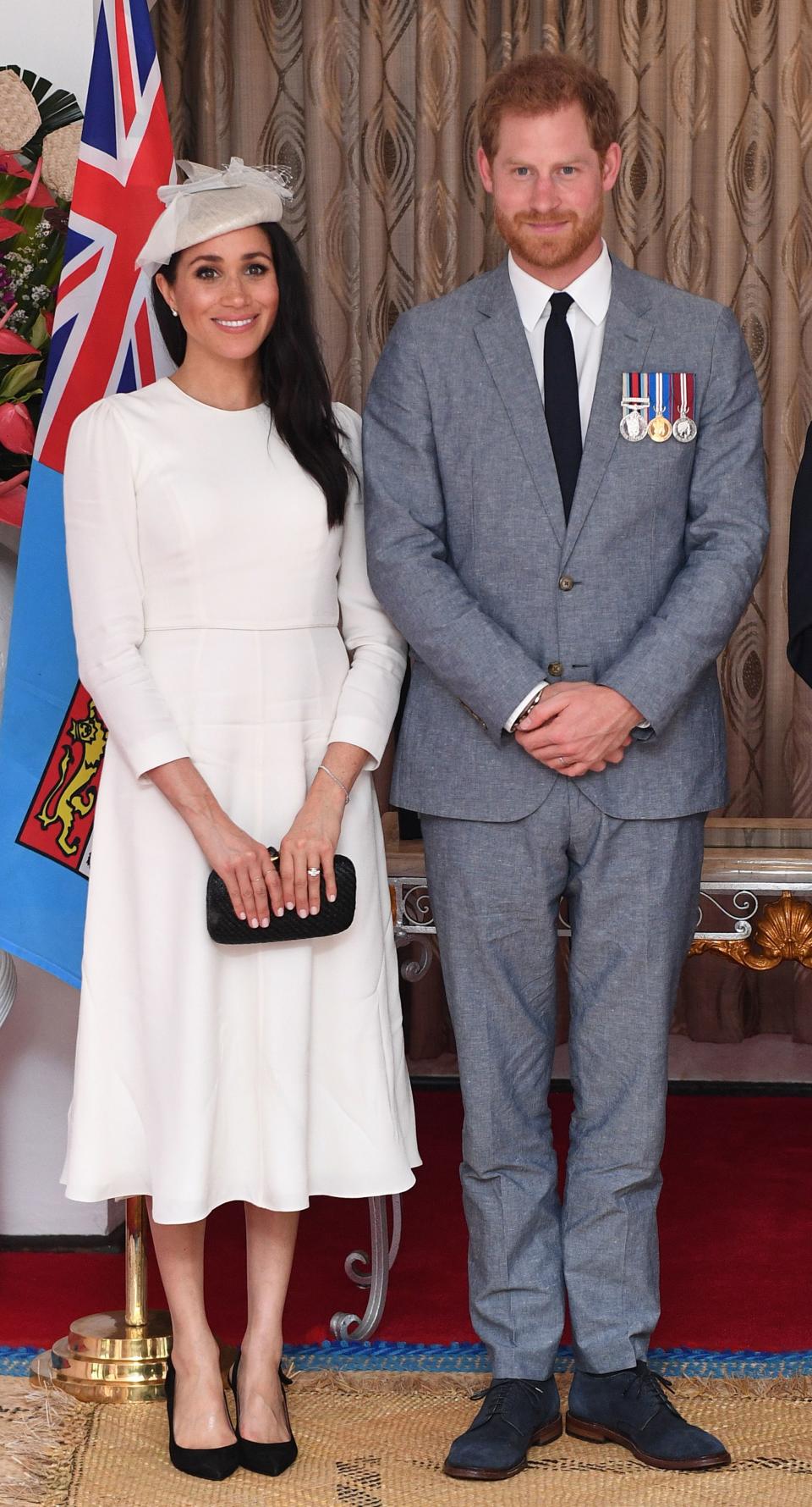 Prince Harry and Meghan Markle pose for a picture
