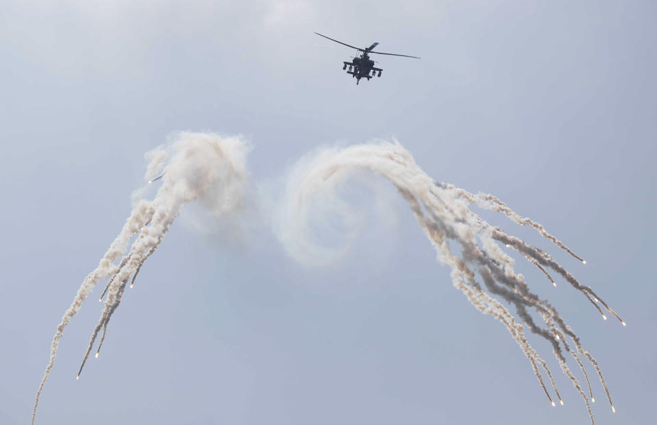 A South Korean AH-64E jet fires flares during the media day for the 74th anniversary of Armed Forces Day at the military base in Gyeryong-City, South Korea, Thursday, Sept. 29, 2022. Armed Forces Day is observed on Saturday, Oct. 1. (Jeon Heon-Kyun/Pool Photo via AP)