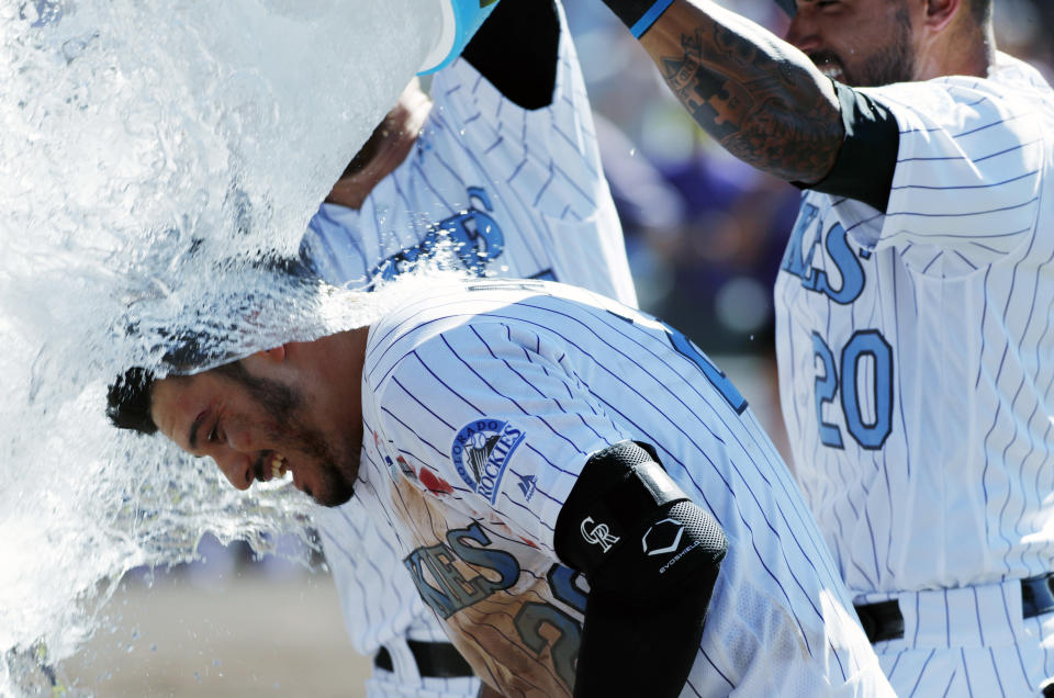 Nolan Arenado is a leader for the Rockies with both his glove and his bat, which is why he will once again garner MVP votes. (AP)