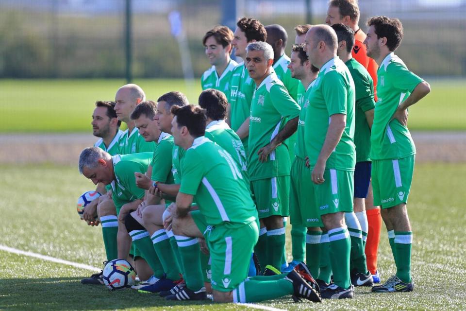 Mayor of London Sadiq Khan (centre) poses for a team photo before the Labour v Journalists annual Labour football match (PA)