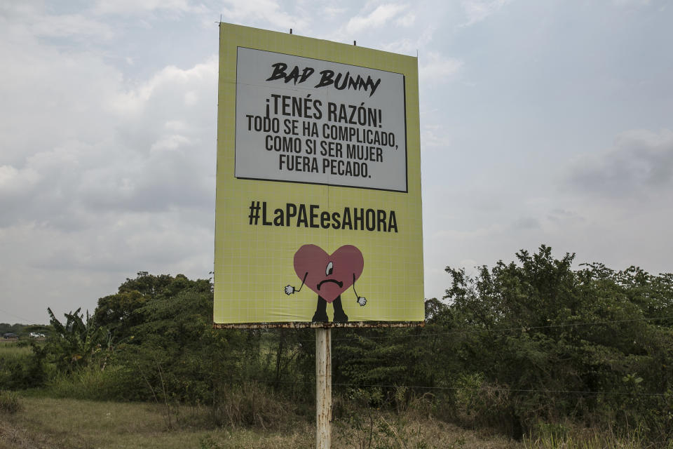A sign promoting the end of a ban in Honduras on the emergency contraceptive pill stands on a road leading to the airport in San Pedro Sula, Honduras, Wednesday, March 15, 2023. It references the rapper Bad Bunny and says in Spanish: “You're right! Everything has complicated, as if being a woman were a sin." On March 8, 2023, Honduras' first female president, Xiomara Castro, ended the ban on the emergency contraceptive pill. (AP Photo/Ginnette Riquelme)