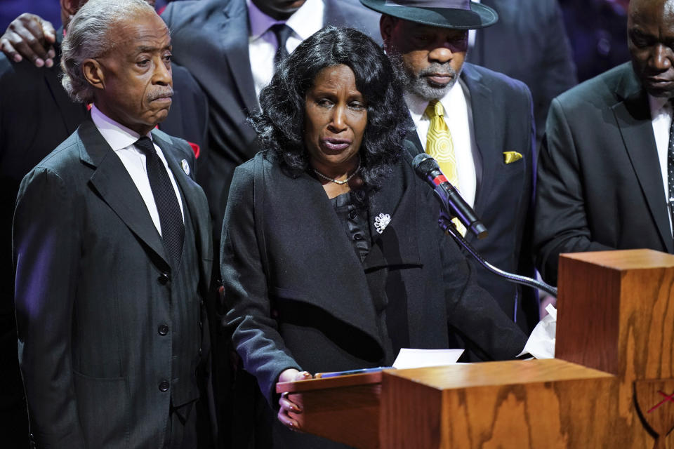 Flanked by Rev. Al Sharpton, left, and her husband Rodney Wells, RowVaughn Wells speaks during the funeral service for her son Tyre Nichols at Mississippi Boulevard Christian Church in Memphis, Tenn., on Wednesday, Feb. 1, 2023. Nichols died following a brutal beating by Memphis police after a traffic stop. (Andrew Nelles/The Tennessean via AP, Pool)