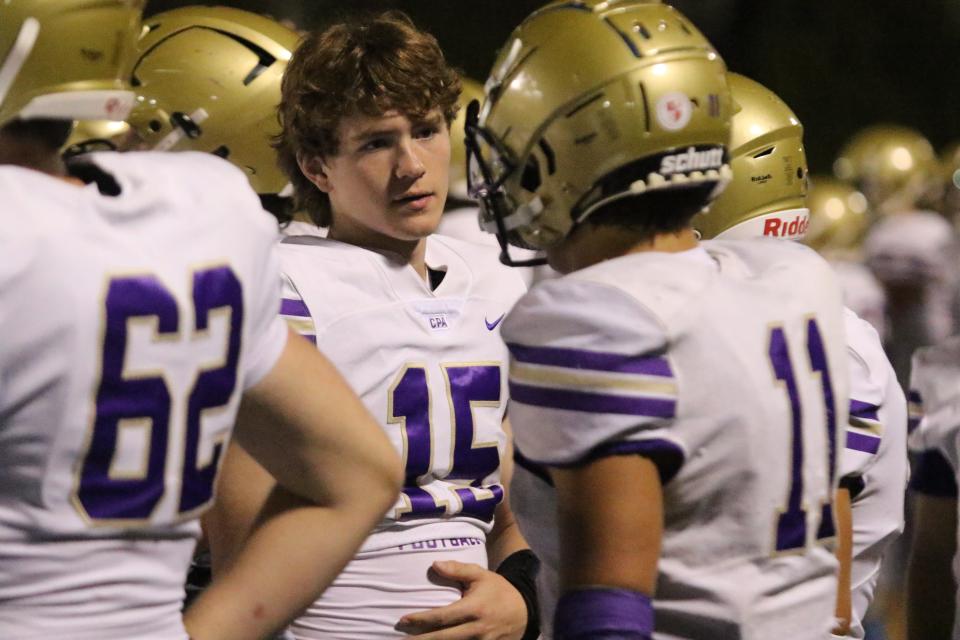 CPA quarterback Braden Streeter (15) talks with linebacker Crews Law (11) on the sideline with the Lions leading, 41-7, late in the third quarter against BGA in a TSSAA Division II-AA Middle Region football game Thursday, Sept. 14, 2023 at Battle Ground Academy.