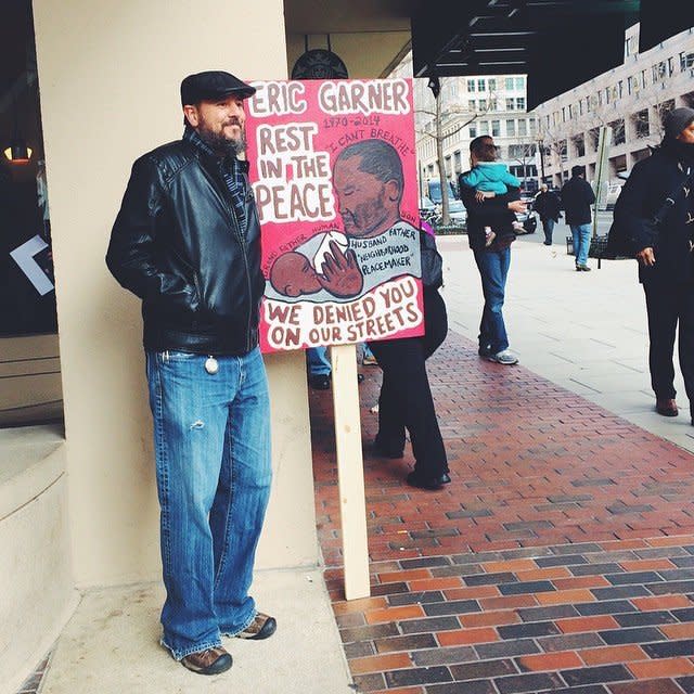 A protester stands in Freedom Plaza in Washington, DC before a march agains police violence on Saturday, Dec. 13, 2014. 