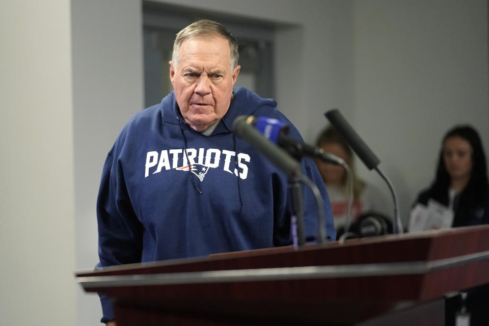 New England Patriots head coach Bill Belichick approaches a podium to take questions from reporters prior to an NFL football practice, Tuesday, Dec. 6 2022, in Foxborough, Mass. (AP Photo/Steven Senne)