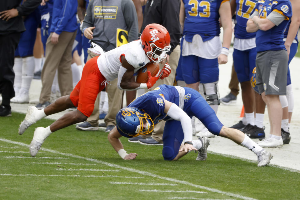 Sam Houston State wide receiver Ife Adeyi, left, catches a pass as he is defended by South Dakota State safety Chase Norblade, right, during the second half of the NCAA college FCS Football Championship in Frisco, Texas, Sunday, May 16, 2021. (AP Photo/Michael Ainsworth)