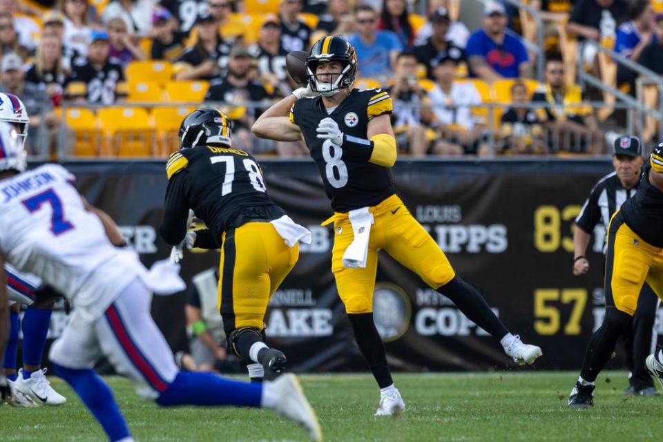 Pittsburgh Steelers quarterback Kenny Pickett (8) throws a pass against the Buffalo Bills Saturday night.