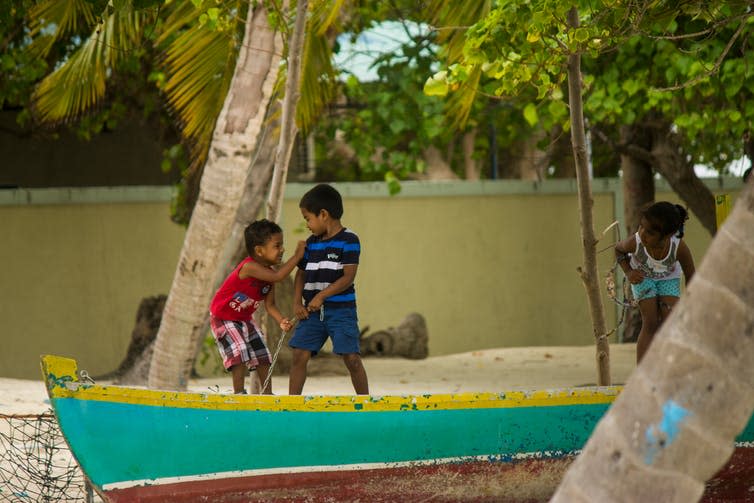 <span class="caption">The Maldives may disappear entirely by 2100 due to sea level rise.</span> <span class="attribution"><a class="link " href="https://www.shutterstock.com/image-photo/gulhi-maldives-september-14-2017-children-1433043119?src=BGQ-QyVMqoRsSY7wE-eYow-1-39" rel="nofollow noopener" target="_blank" data-ylk="slk:Guadalupe Polito/Shutterstock;elm:context_link;itc:0;sec:content-canvas">Guadalupe Polito/Shutterstock</a></span>