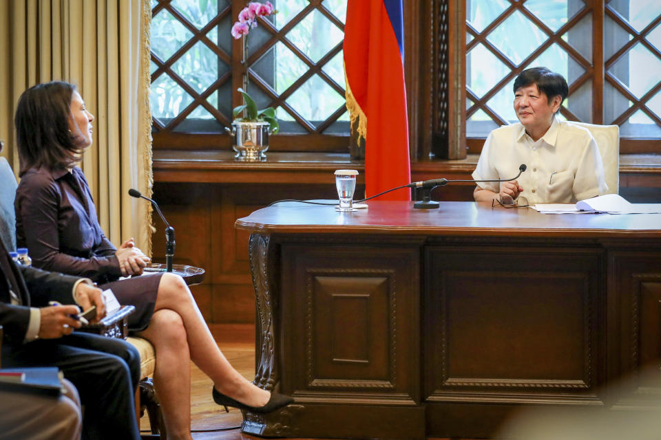 In this handout photo provided by the Malacanang Presidential Communications Office, Philippine President Ferdinand Marcos Jr., right, talks with German Foreign Minister Annalena Baerbock during her courtesy call at the Malacanang presidential palace in Manila, Philippines on Thursday Jan. 11, 2024. (Malacanang Presidential Communications Office via AP)