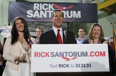 Republican presidential candidate and former U.S. Senator Rick Santorum is flanked by his daughter Elizabeth (L) and wife Karen (R), as he formally declares his candidacy for the 2016 Republican presidential nomination during an event in Cabot, Pennsylvania, May 27, 2015. REUTERS/Aaron Josefczyk