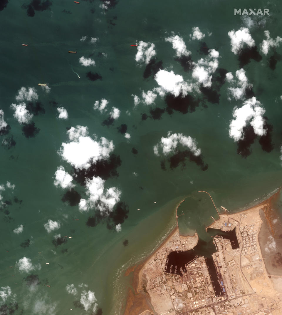 This Monday, July 22, 2019 Maxar Technologies shows an overview of Iranian port city of Bandar Abbas with the British-flagged oil tanker Stena Impero at the top center. President Hassan Rouhani suggested on Wednesday, July 24, that Iran might release the U.K.-flagged ship if Britain takes similar steps to release an Iranian oil tanker seized by the British Royal Navy off Gibraltar earlier this month. His remarks could create an opening to reduce tensions as Boris Johnson becomes prime minister. (Satellite image ©2019 Maxar Technologies via AP)
